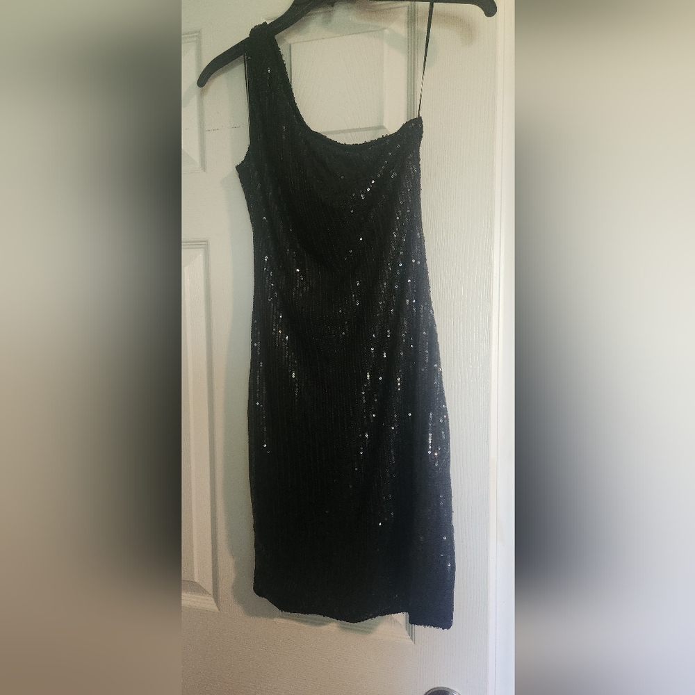 Brand new Medium black sequence dress. Never worn!!